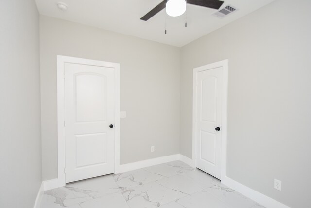 unfurnished room with ceiling fan