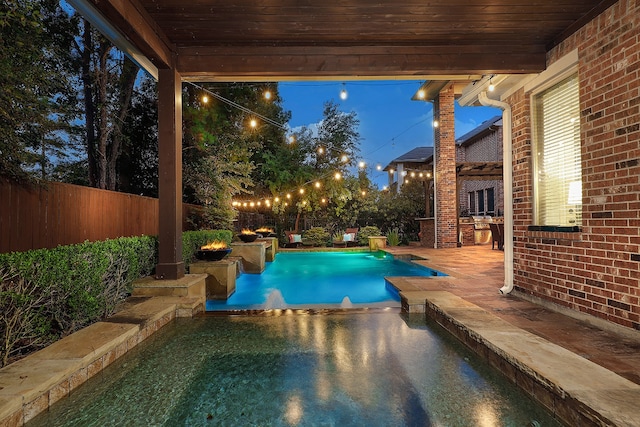 view of swimming pool featuring a patio and pool water feature