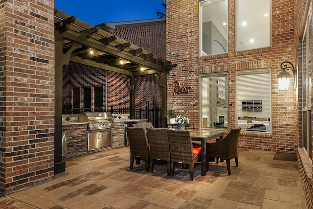 view of patio / terrace with a pergola, area for grilling, and a grill