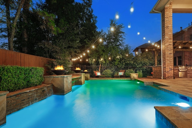 pool at twilight featuring a patio