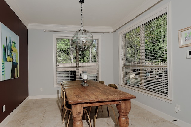 tiled dining area featuring a healthy amount of sunlight, crown molding, and a chandelier