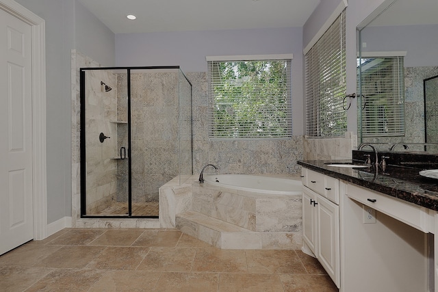 bathroom with plus walk in shower and vanity