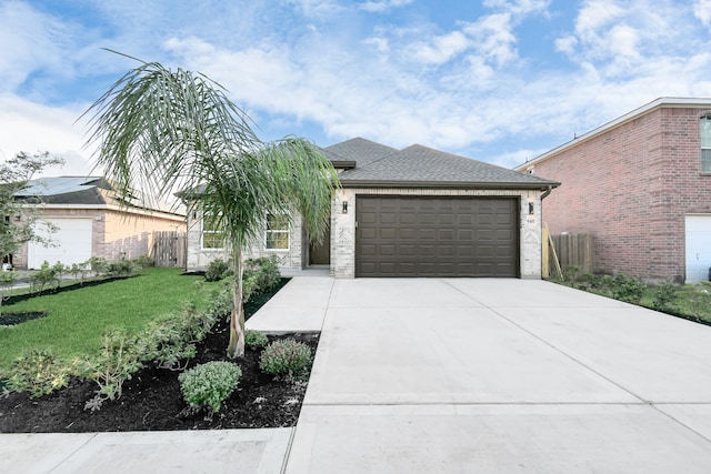 view of front facade with a garage and a front yard