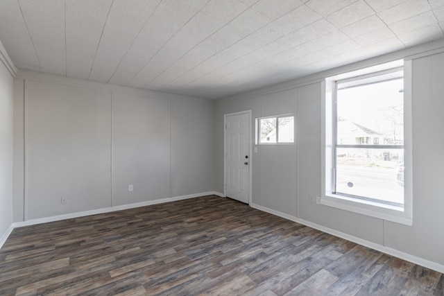 empty room featuring dark wood-type flooring