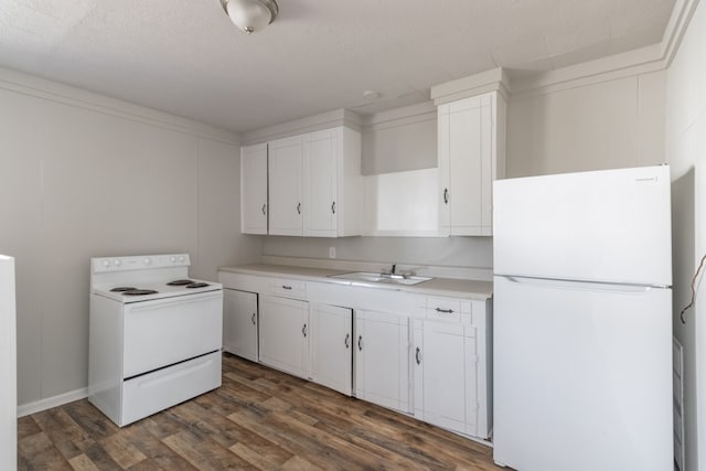 kitchen with sink, white appliances, a textured ceiling, white cabinetry, and dark hardwood / wood-style floors