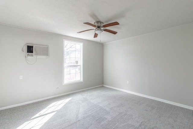 carpeted empty room featuring ceiling fan and a wall mounted AC