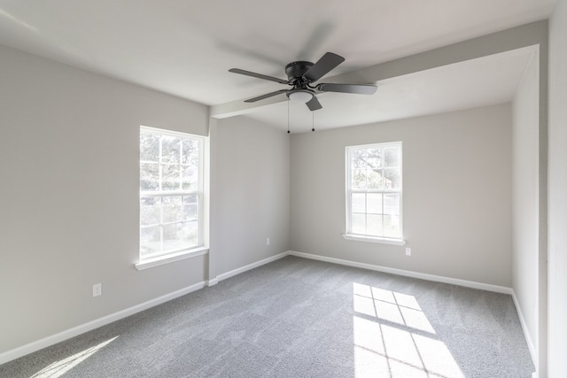 carpeted empty room with ceiling fan