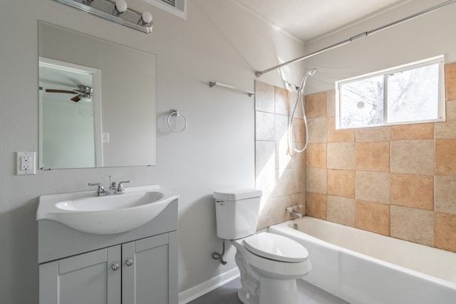 full bathroom with ceiling fan, toilet, tile patterned floors, tiled shower / bath combo, and vanity