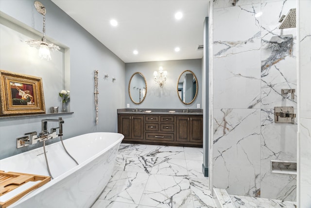 bathroom with vanity and separate shower and tub