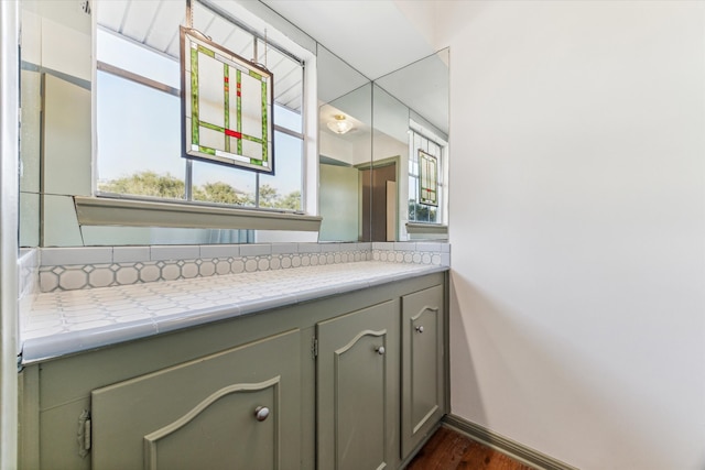 bathroom with wood-type flooring and vanity