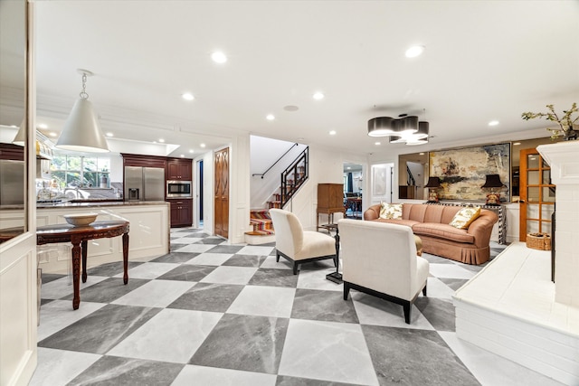 living room featuring crown molding