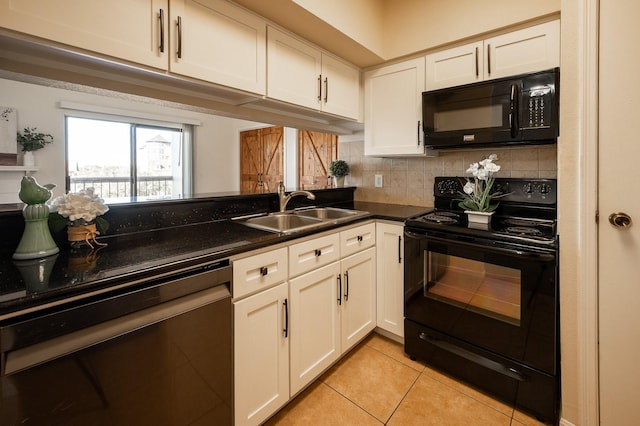 kitchen with sink, light tile patterned floors, decorative backsplash, white cabinets, and black appliances