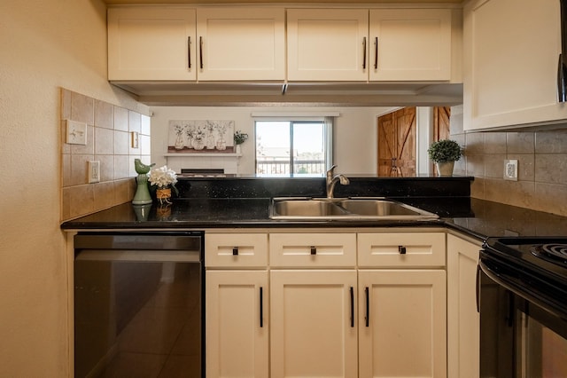 kitchen featuring dishwasher, white cabinets, and sink