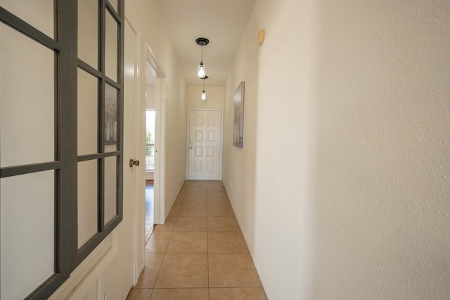 hall with light tile patterned flooring