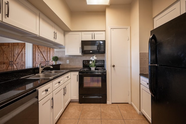 kitchen with black appliances, light tile patterned flooring, white cabinets, and sink