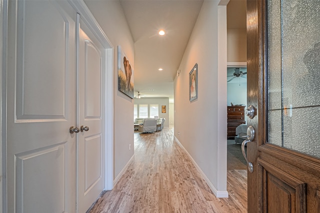 hallway with light hardwood / wood-style flooring