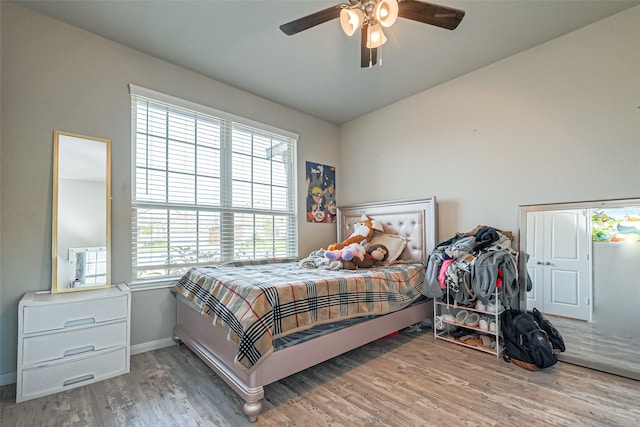 bedroom with hardwood / wood-style floors and ceiling fan