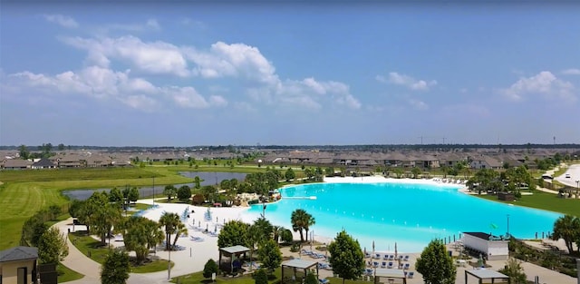 birds eye view of property with a water view