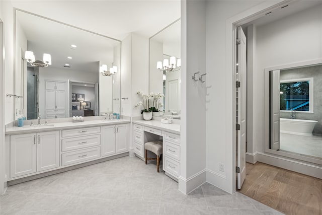 bathroom with vanity and wood-type flooring