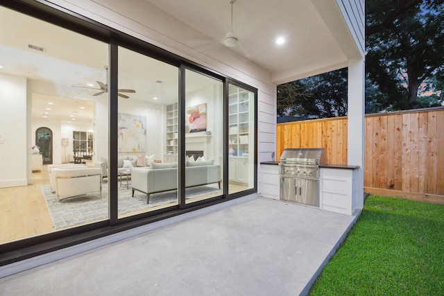 view of patio / terrace with ceiling fan and area for grilling