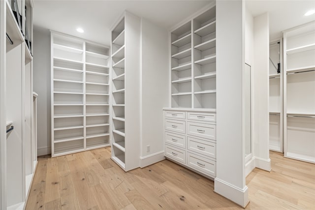 walk in closet featuring light hardwood / wood-style floors