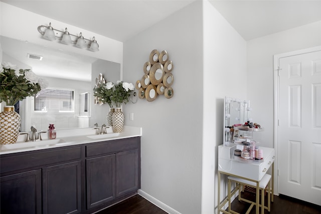 bathroom with wood-type flooring and vanity