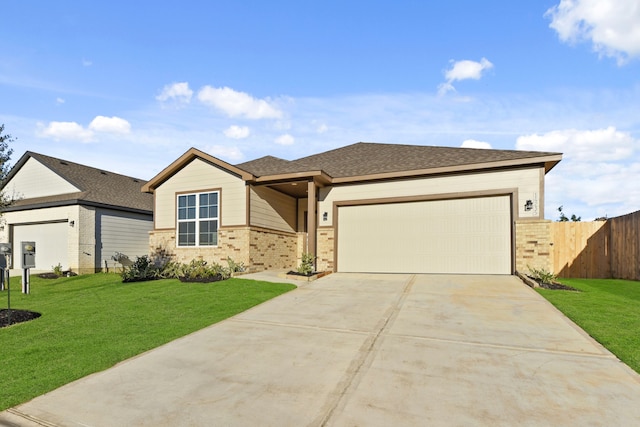 view of front of property with a garage and a front yard