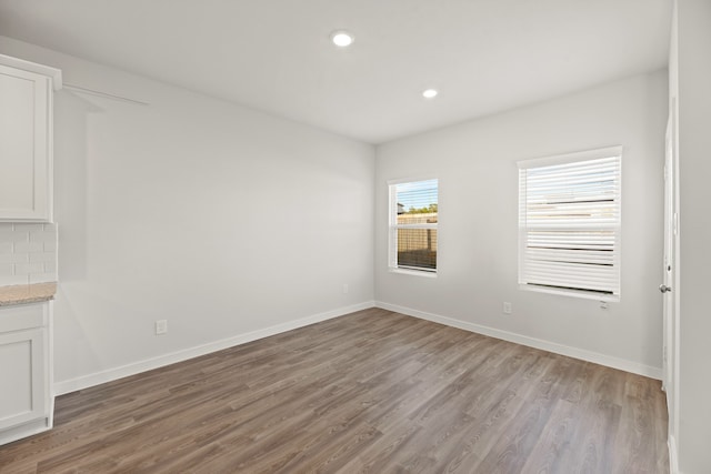 empty room with light wood-type flooring