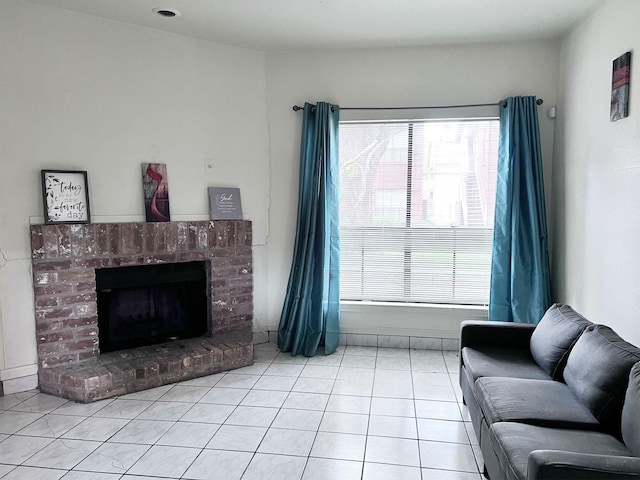 living room featuring light tile patterned floors, plenty of natural light, and a brick fireplace