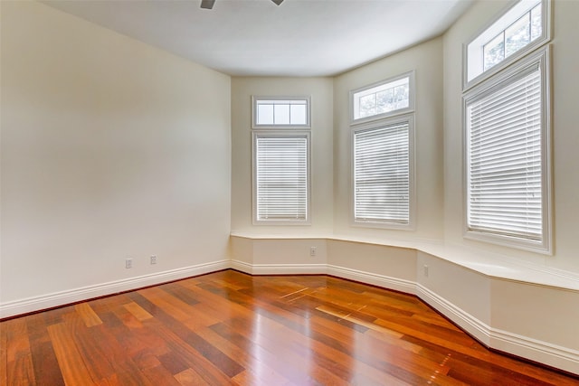 unfurnished room featuring hardwood / wood-style flooring