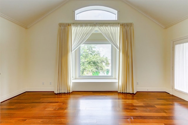 bonus room with hardwood / wood-style flooring and vaulted ceiling