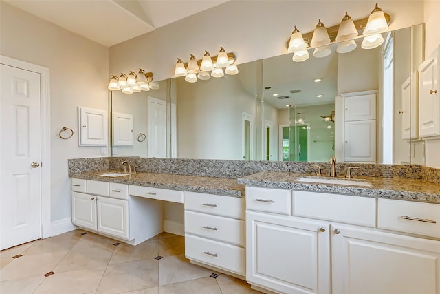 bathroom with tile patterned flooring and vanity