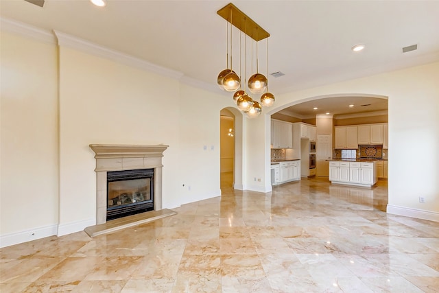 unfurnished living room featuring ornamental molding