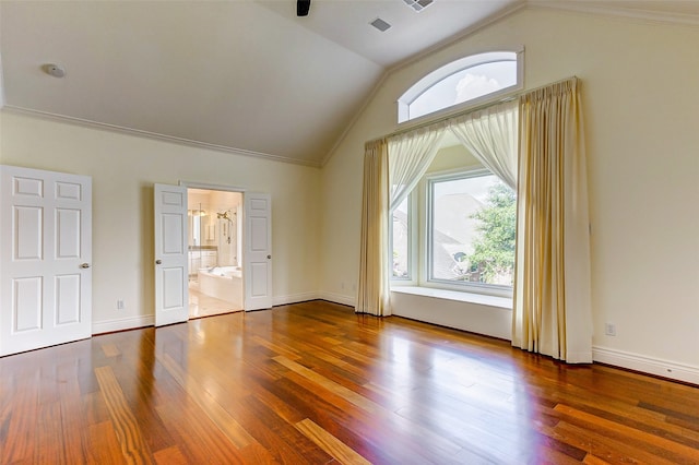 additional living space with lofted ceiling and hardwood / wood-style floors