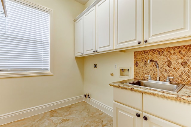 laundry area with hookup for a gas dryer, cabinets, hookup for a washing machine, sink, and electric dryer hookup