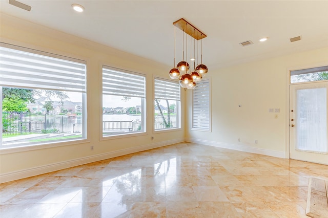 interior space with a water view and a chandelier