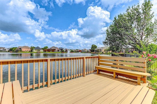 dock area featuring a deck with water view