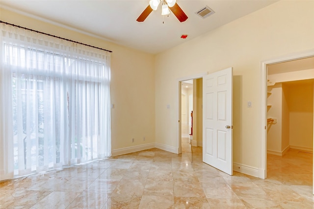 empty room featuring ceiling fan