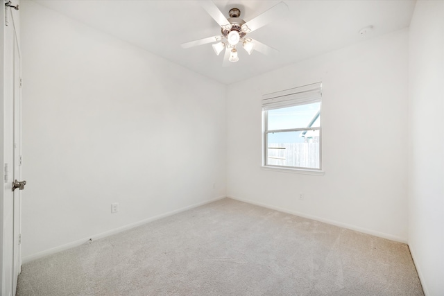 unfurnished room with ceiling fan and light colored carpet