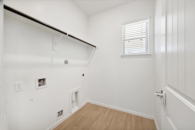 laundry room featuring washer hookup, gas dryer hookup, light hardwood / wood-style floors, and electric dryer hookup