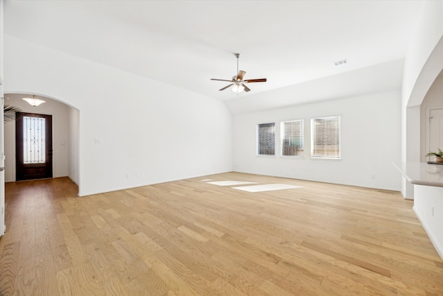 unfurnished living room with plenty of natural light, light hardwood / wood-style floors, and ceiling fan