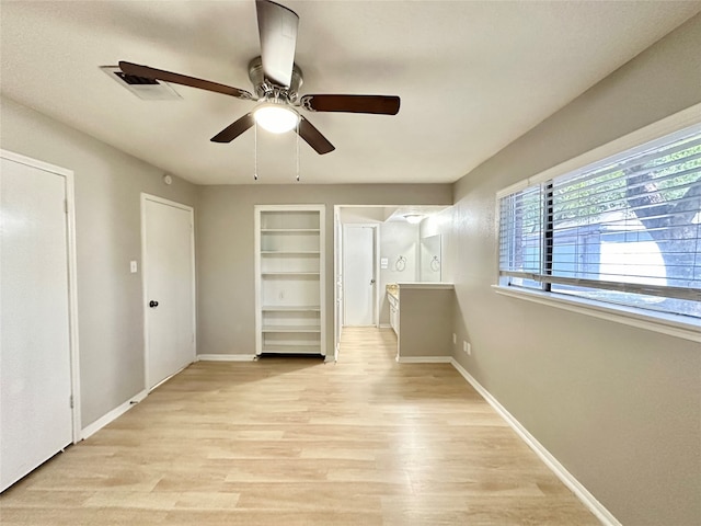 interior space with ceiling fan and light wood-type flooring