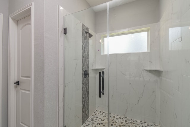 bathroom featuring an enclosed shower