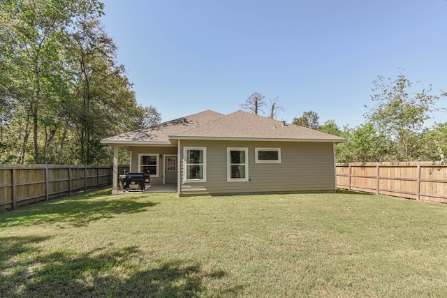 back of property featuring a lawn and a patio