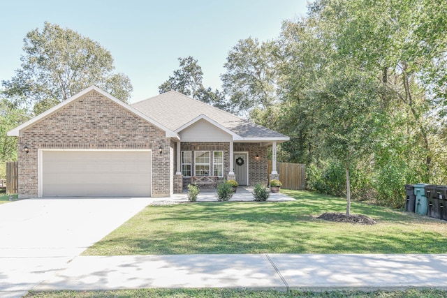 view of front of home with a garage, a porch, and a front yard