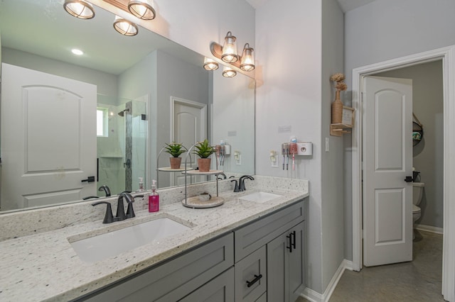 bathroom with an enclosed shower, vanity, and toilet