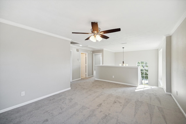 unfurnished room with ceiling fan, light colored carpet, and ornamental molding