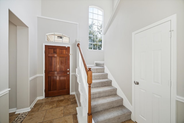 foyer featuring a high ceiling