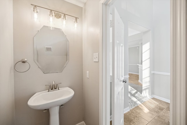 bathroom with sink and tile patterned floors