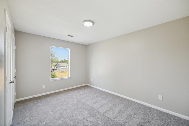 unfurnished room with carpet floors